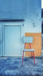 Chair on blue door