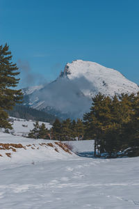 A picturesque vertical landscape view of the french alps mountains on a cold winter day