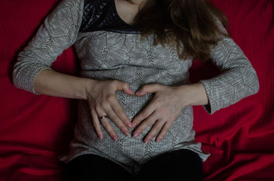 Close-up of woman relaxing on ground