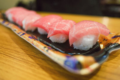 Close-up of sushi in tray on table