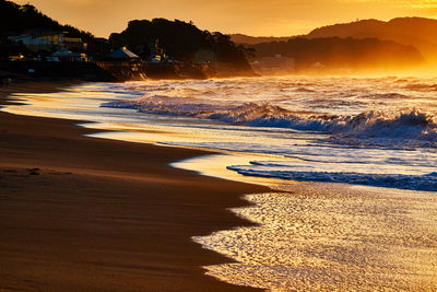 Scenic view of sea against sky during sunrise