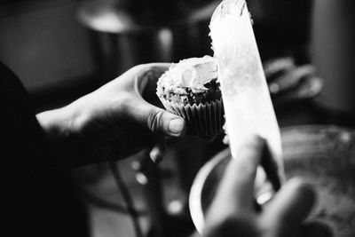 Close-up of hand holding ice cream