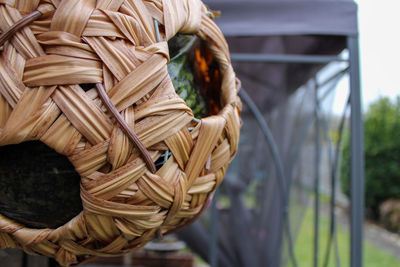 Close-up of rope tied on wood in field