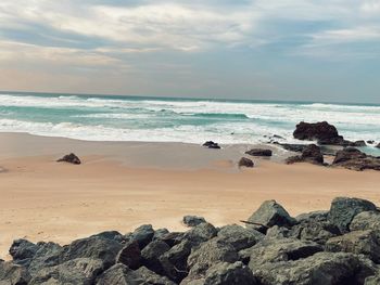 Scenic view of beach against sky