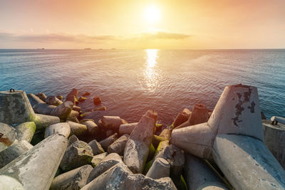 Scenic view of sea against sky during sunset