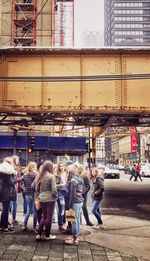 People walking on street in city