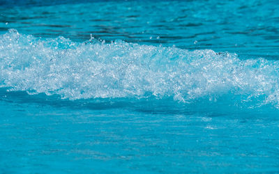 Close-up of water splashing in swimming pool