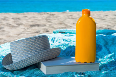 Close-up of open book on beach