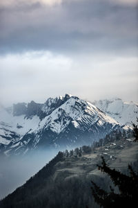 Scenic view of snowcapped mountains against sky