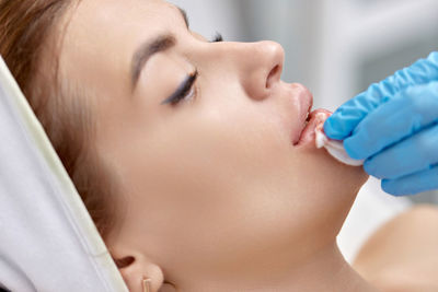 Close-up of young woman drinking milk