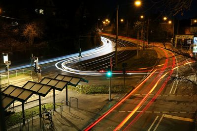 High angle view of light trails on road at night