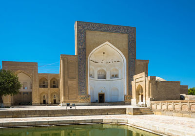 View of historical building against clear blue sky