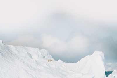 Scenic view of snow covered mountain against sky