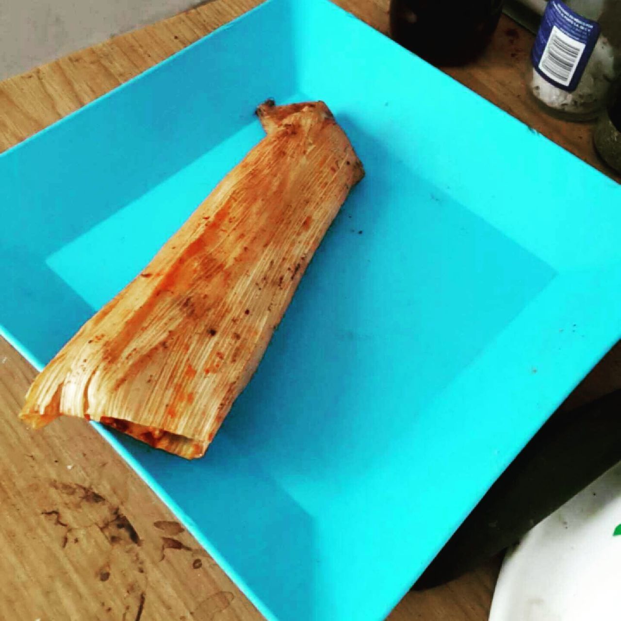 wood - material, indoors, table, high angle view, food and drink, food, still life, wooden, blue, close-up, wood, freshness, no people, directly above, cutting board, day, plank, plate, ready-to-eat, slice