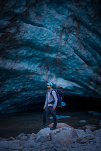 Man standing on rock in snow