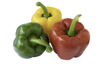 Close-up of bell peppers against white background