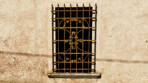 Close-up of window on metal grate