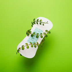 High angle view of dices on yellow background