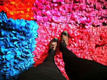 Low section of woman standing on tiled floor