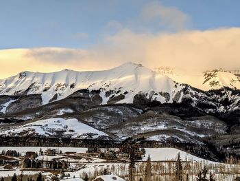 Scenic view of snowcapped mountains against sky