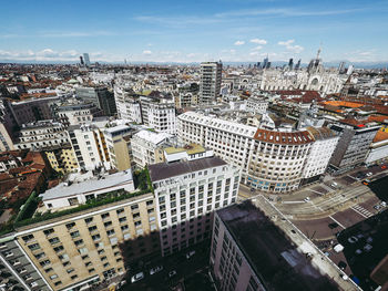 High angle view of modern buildings in city against sky