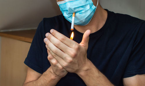 Midsection of man holding hands