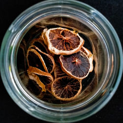 High angle view of fruit in glass jar on table