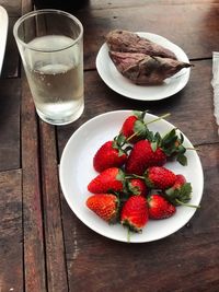 Close-up of strawberries in glass on table