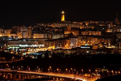 High angle view of illuminated buildings in city at night