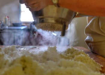 Close-up of man preparing food