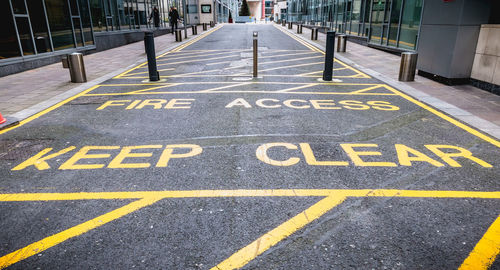 Text on road by railing