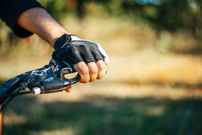 Close-up of man riding bicycle in forest