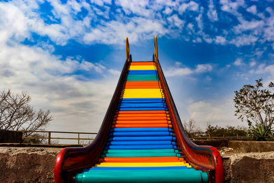 Low angle view of multi colored building against sky