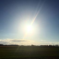 Scenic view of field against sky during sunset
