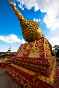 Low angle view of statue against temple