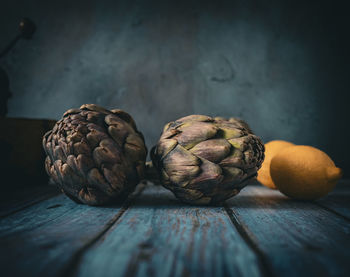 Close-up of pine cone on table