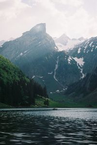 Scenic view of snowcapped mountains against sky in the mountains of switzerland in summer. 