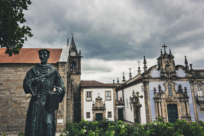 Statue of building against sky