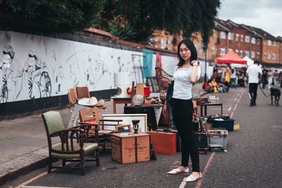 Portrait of woman standing on table