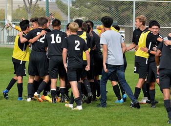 Group of people on soccer field