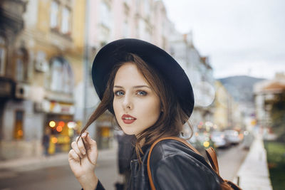Portrait of young woman outdoors in the city