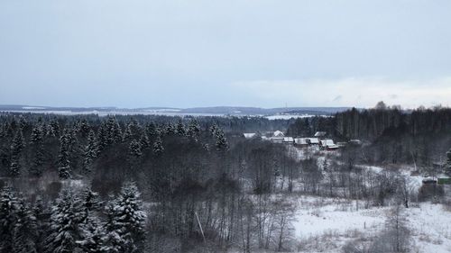 Scenic view of lake against sky during winter