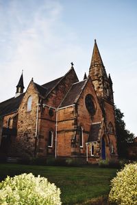 Church by plants against sky