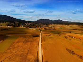 Scenic view of agricultural landscape against sky