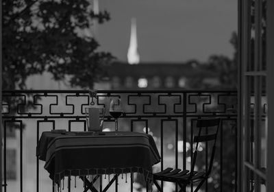 Empty chairs and tables in building