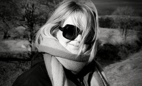 Portrait of woman wearing sunglasses outdoors