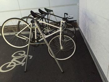 High angle view of bicycle parked against wall