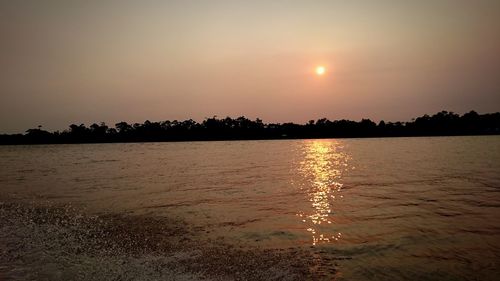 Scenic view of sea at sunset