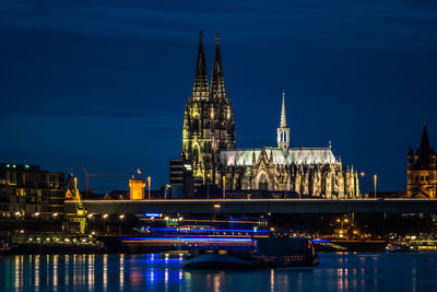 Illuminated buildings in city at night