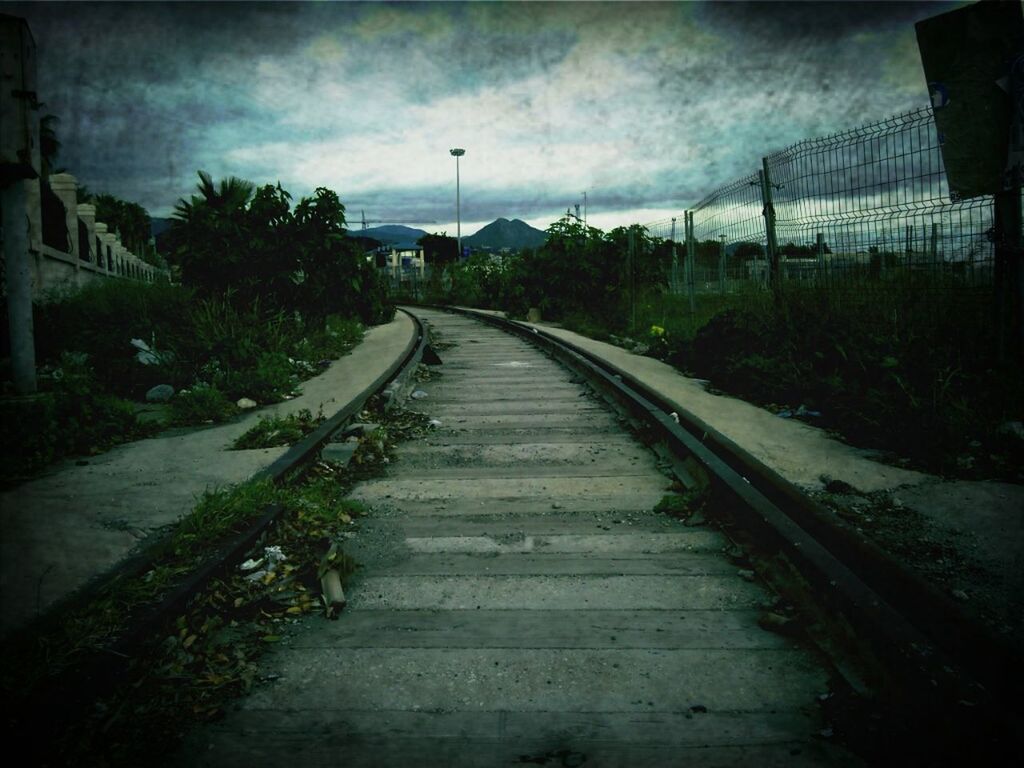 the way forward, sky, diminishing perspective, cloud - sky, vanishing point, transportation, built structure, cloudy, auto post production filter, architecture, tree, railroad track, cloud, long, building exterior, transfer print, road, outdoors, no people, empty